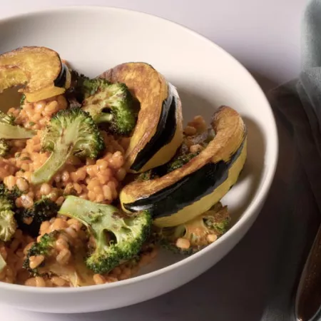 grains, broccoli, and other vegetables in white bowl