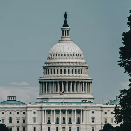 The U.S. Capitol Building with a hazy sky behind it