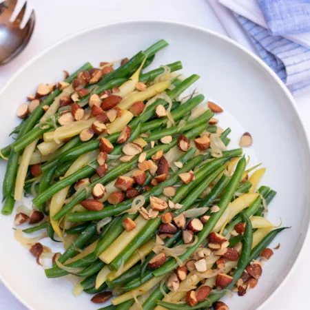 Plate filled with green beans and chopped almonds