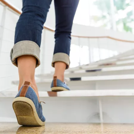 feet of a person climbing the stairs
