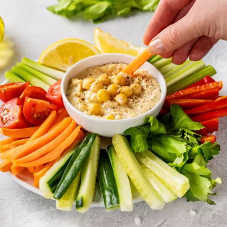 plate of veggie with dip in the midde