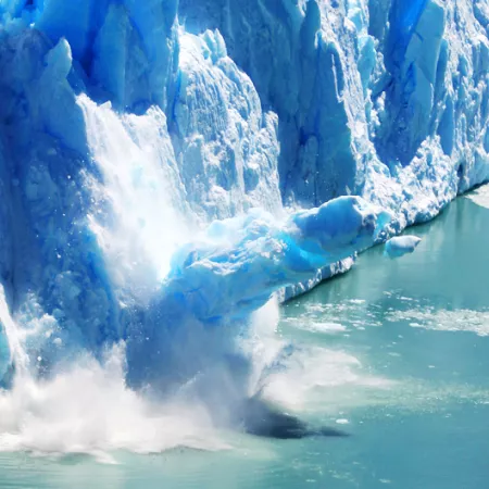 a glacier melting into a lake