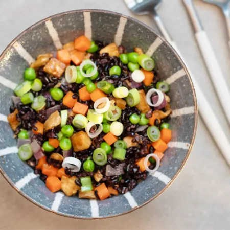bowl filled with black rice and chopped veggies