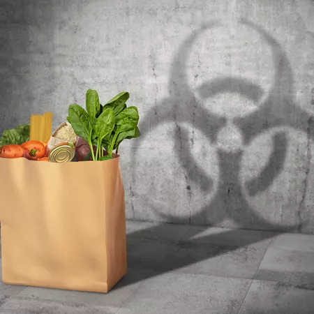 grocery bag casting a shadow of a hazardous chemical symbol