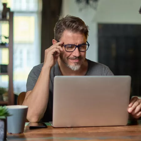 man looking at a computer screen