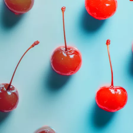 regular cherries fading into maraschino cherries
