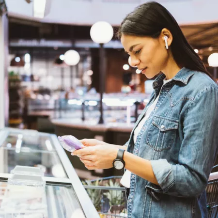 woman reading a package label
