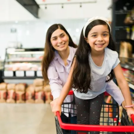 A woman and girl grocery shop