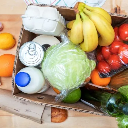 A box of perishable and non-perishable food items for donation