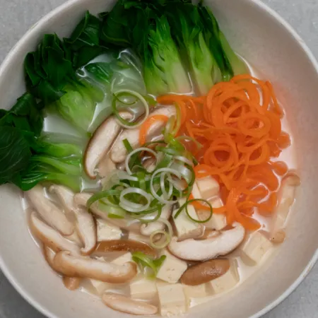 bowl filled with vegies sitting in miso broth