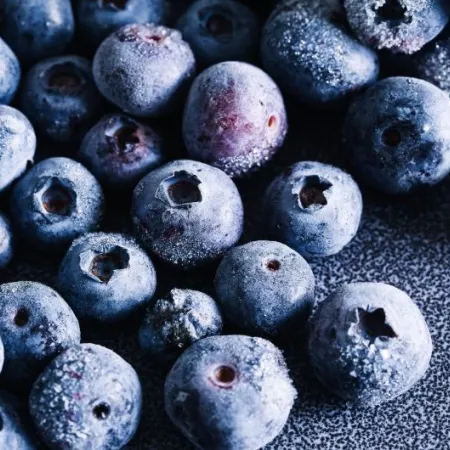Frozen blueberries closeup with frost texture