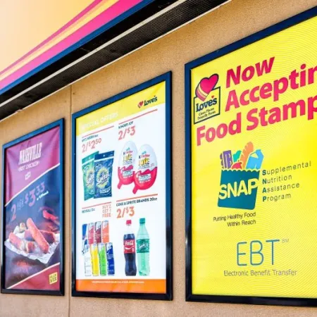 Exterior signage at a convenience store; closeup for SNAP (food stamps)