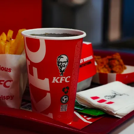 A KFC meal prominently featuring a fountain soda