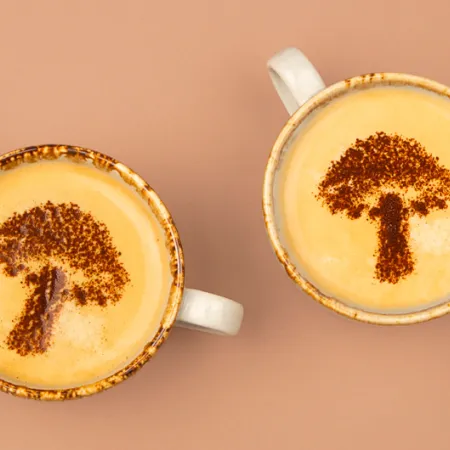 flat lay of mugs with mushroom shaped art