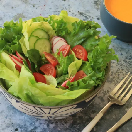 bowl of salad greens and vegetables