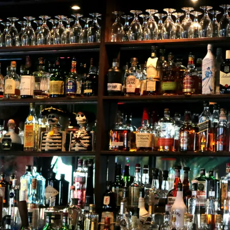Bar shelf with a variety of liquor