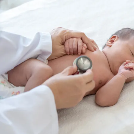 doctor listening to a baby's heart